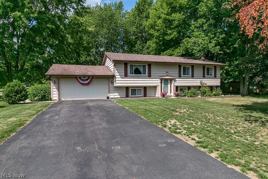 * NEW * 2,700 sq. ft. 4 Bed / 3 Bath Mentor * Amazing Location / HUGE Yard * Open Living Room / Dining Room / Kitchen Layout on the Main Floor * Glass Sliders to Rear Screened Porch overlooking the Half Acre Lot * Living Room and Family Room * Ceramic Tile Foyer Entry * Ceramic Floor Kitchen / Corian Tops / Recessed Lighting / Breakfast Bar * Master Bedroom w/ Master Bath and Double Closet * HUGE Lower Level Family Room w/ Brick Fireplace * Bonus Room / 4th Bedroom / w/ 3rd Bathroom * 200 sq. ft. Utility Room * 200 sq. ft. Laundry Room * HALF ACRE Lot w/ Elevated Deck / Screened in Patio / Brick Paver Patio / Storage Shed / Privacy Fence / Beautiful Landscaping * Thermalock Insulation / Shed and Patio Stones / Sprinkler System * MUST SEE *