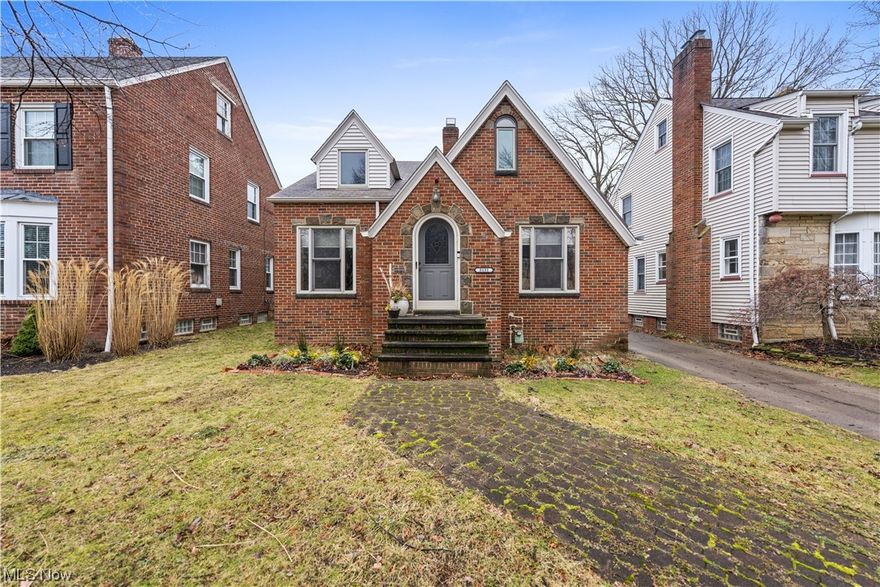 Welcome home to this remarkable 3 bedroom, 2.5 bath, all brick home that you will be sure to fall in love with the moment you step foot inside. Exuding character inside and out! Walk into your welcoming foyer that features a wood lined ceiling and custom front door. Spacious living room is truly the perfect spot to relax or entertain. Large dining room boasts ornate  cabinets & space for a full sized table! The kitchen is the star of the show with custom hardwood cabinetry, comfort height corian counters, durable appliances, plenty of storage & more! 2 spacious 1st floor bedrooms boast hardwood flooring, ceiling fans and tons of closet space. 1st floor bath is full of upscale amenities including tile accents, modern vanity, heat lamps, & more! Upstairs you will find the oasis that is the owners suite which boasts tall ceilings with a gorgeous wood feature, plus 3 huge closets, 2 dormers for a home office or flex space plus a full on-suite bath with heated floors, heated fan, beautiful shower surround, modern vanity & more! 1st level also provides a wonderful 3 season sunroom! Downstairs you will find ample room to make your own home gym, a second living space, playroom or more, all while having plenty of room for storage. Basement also features a laundry area, workshop area and a 1/2 bath! Enjoy your private backyard that features a lush perennial pollinator garden that is packed with beautiful spring bulbs and native flowers. Additional small scale garden beds are lined with handsome brick pavers. Perfect for the green thumb to grow vegetables, flowers, & herbs. Storage shed for gardening tools & equipment! 1 car extra deep garage! Home has many updates including new electrical with outlets galore, replacement windows throughout, quality crafted wood panel doors, all drywall walls, recessed lighting and more! H20 tank 2021! 1 year home warranty! Close to the metroparks, shopping and restaurants. Located on the Cleveland Lakewood border. Schedule a tour today!