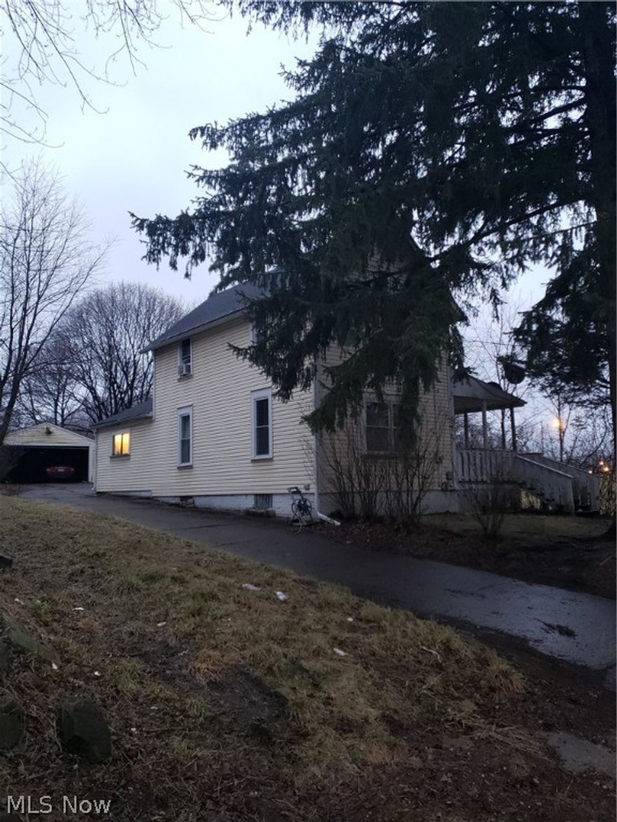 3 bed 1 bath home in Akron. Rent ready.  Selling with extra lot in rear.
