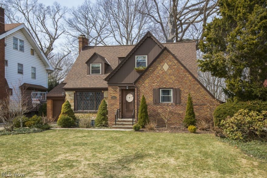 Prepare to be moved into this classic brick and stone cape cod overlooking the Metroparks. Charm and character abound with exposed wood work, built in cabinets and lead glass windows. Greet your guests through the spacious foyer complete with chandelier. The Large living room features a cozy built in window seat, lead glass windows and wonderful wood burning fireplace.  Formal dining room comes with a built in buffet and cabinets with more lead glass and an amazing view of the back yard through the large picture window. The light and bright kitchen will draw you in with a cozy breakfast nook, bay window, ample cabinet space, large pantry and newer ceramic tile floors. A  large master bedroom with amazing wood floors is also on the first floor.  The main bath has been tastefully updated while still maintaining the old world charm. There are 3 more bedrooms on the second floor & a full bathroom ready to be finished off.  Relax in the finished basement with fantastic rec room area, office