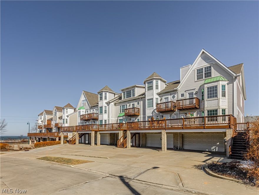 Modern luxury meets lakefront living in this beautifully updated corner unit townhome at the Belvedere, offering sweeping Lake Erie views and unforgettable sunsets. Located in the heart of Cleveland’s Gordon Square Arts District, this spacious four level residence combines thoughtful upgrades, flexible living space, and an unbeatable North Coast location.
The main living level welcomes you with a light filled great room anchored by a striking fireplace finished in custom sized marble tile, flowing into a generous dining area and an eat in peninsula kitchen ideal for everyday living or entertaining. Recent updates give the home a clean, modern feel throughout, including fresh paint on all walls and trim, continuous vinyl plank flooring across all four levels and staircases, and upgraded lighting that adds warmth and function to the kitchen and living spaces.
The second level features an oversized owner’s suite with walk in closet, private full bath, and balcony access, along with a spacious guest bedroom and a second full bath. The third level is a showstopper, offering a massive open space with soaring ceilings and breathtaking views of Lake Erie. This level works beautifully as a third bedroom, media lounge, or an impressive entertaining space. The lower level adds valuable flexibility with bonus space ideal for a home office, workout area, or additional storage, and provides direct access to the attached garage. This spacious and luxurious corner unit is just blocks from the Capitol Theatre, Cleveland Public Theatre, 78th Street Studios, Gypsy Bean Coffee, and a wide variety of restaurants, shops, and galleries. The Lakefront Bikeway is right around the corner with easy access to Edgewater Park. Downtown Cleveland, the Shoreway, and Route 90 are minutes away, offering a quick commute to the Cleveland Clinic, University Hospitals, and other major employers.This is more than a home. It is a lifestyle defined by lake views, culture, walkability, and quality of life
