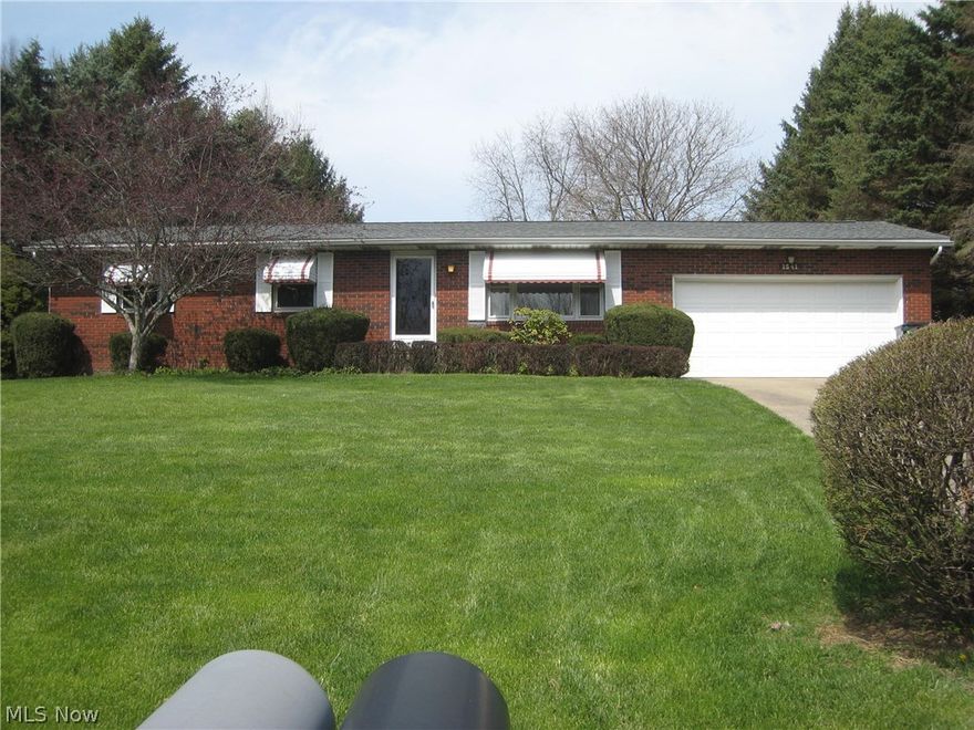 Custom built and meticulously maintained ranch located 5 minutes from 77,  schools and the amenities of the thriving community of Green.  The many updates of this home include pergo wood flooring, roof, upgraded electric, radon mitigation system and insulated steel front door. The open kitchen/dining room is great for entertaining and walks out to the 3 season porch overlooking the private yard. The 3 bedrooms offer plenty of closet space,  and the master bedroom will accommodate your king size furniture. The lower level rec room adds an additional 516 sq.ft. of living area and features a bar and another full bath.  Lots of built in shelving for storage and a workbench, too.  All appliances stay including the washer and dryer.