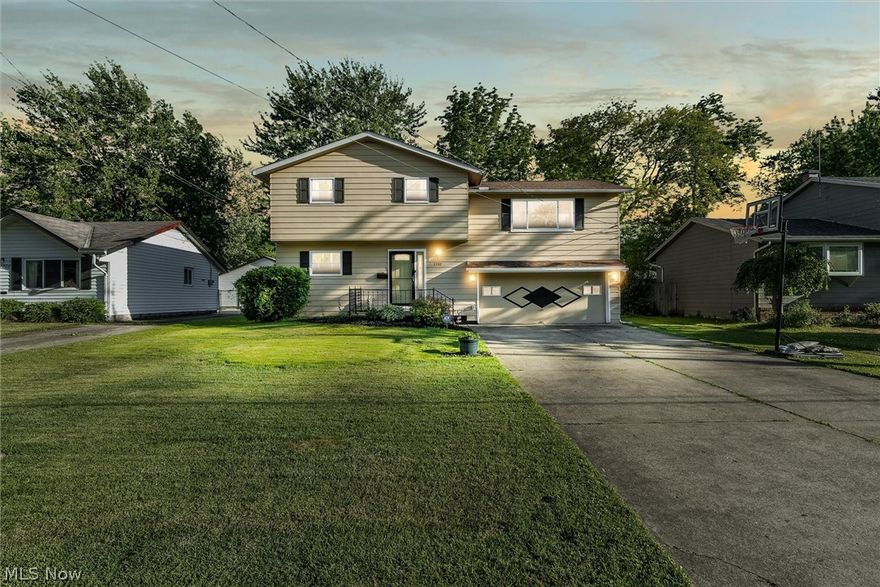 COME OUT AND SEE this amazing 4 bedroom home offering something for everyone...multiple indoor AND outdoor living areas offer plenty of space to stretch out...and ALL indoor living space is above-grade! The first level features a bedroom with adjacent half bath plus a generous family room that is connected to a private, rear-facing sunroom by glass sliders. Head up to the middle level to find semi-open kitchen, dining, and living areas featuring dark wooden ceiling beams and vaulted ceilings. In the kitchen, enjoy granite countertops, beautiful tile backsplashes, and matching stainless steel appliances. Exit the glass sliders from the dining room and find a huge raised deck overlooking the backyard with stairs leading to a newer large, concrete patio that connects to the sunroom and rear garage door. Many possibilities in the backyard which features an oversized third garage with overhead door - perfect for a future dad-cave, she-shed, workshop, or kid's getaway! Back in the home, find