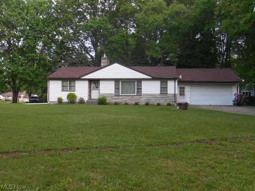 Great potential here on this excellent corner lot ranch home! Vinyl sided, clean exterior, low maintenance landscaping and attached 2 car garage greet you as you pull into the drive! The spacious Living room/dining room combination has brand new in Sept 2014 plush neutral carpeting and a beautiful working fireplace that is a nice accent to your room! All Three of the bedrooms are nice sized. The master and bedroom 2 have a nice double closet and hardwood flooring! Bedroom three is newly carpeted in Sept 2014 and has a nice surprise, the closet has been made into First Floor Laundry if you would like to utilize! If not, feel free to use the closet, the hookups for washer and dryer are also downstairs in the full basement! The kitchen is cute with appliances to stay, electric stove, portable dishwasher, fridge. There's enough room for a breakfast table as well! The full bath has new flooring Sept 2014. Roof 2010. Water Tank 2012. Alarm System. Garage has attic access, electric and auto d
