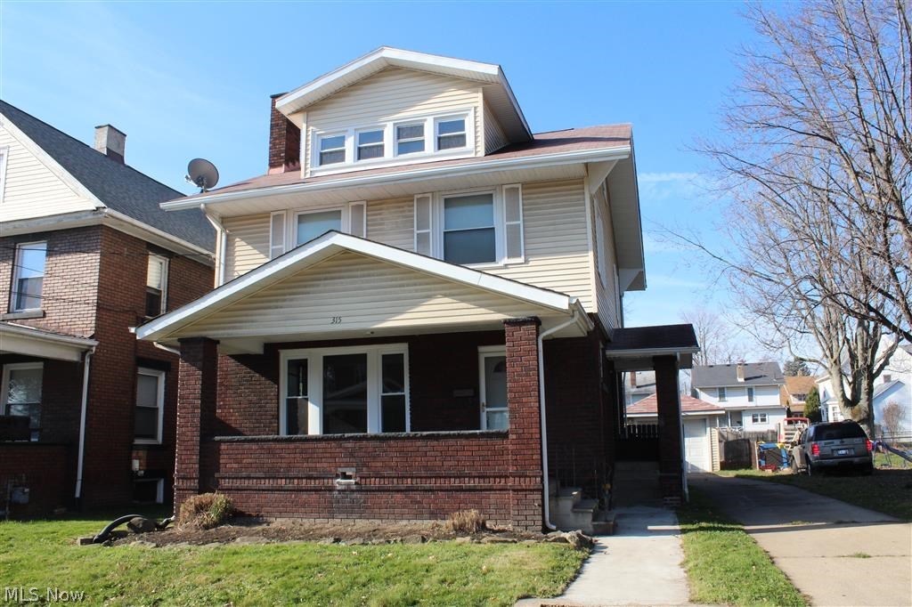 This is truly an extraordinary value for only $65,000! The seller bought it as an investment and long-term tenant just vacated, so it's a good time to sell. The long list of updates include a brand new furnace with central air (last week), custom, updated kitchen, a mixture of newer carpet, ceramic and laminate wood flooring throughout, glass block windows, updated full bath plus extra shower, sump pump, some newer windows, 2 car garage with garage door opener, finished 3rd story, paved driveway, vinyl siding, roof and newer appliances. Every room is spacious and updated with fresh paint & flooring. This great old home, with the large, covered front porch, is convenient to absolutely everything and offers SO much for the money. You can't afford to pass this up.