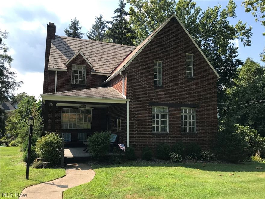 LOTS OF CHARACTER in this 2 story, 3 bedroom brick home that features original woodwork, glass door knobs, cozy porch, and lots of natural light in sought after neighborhood.  Amenities include original wood floors under carpet, 2nd bathroom in basement, white kitchen cabinets, and new dishwasher sitting on 2 lots.  Call today for your private showing.
