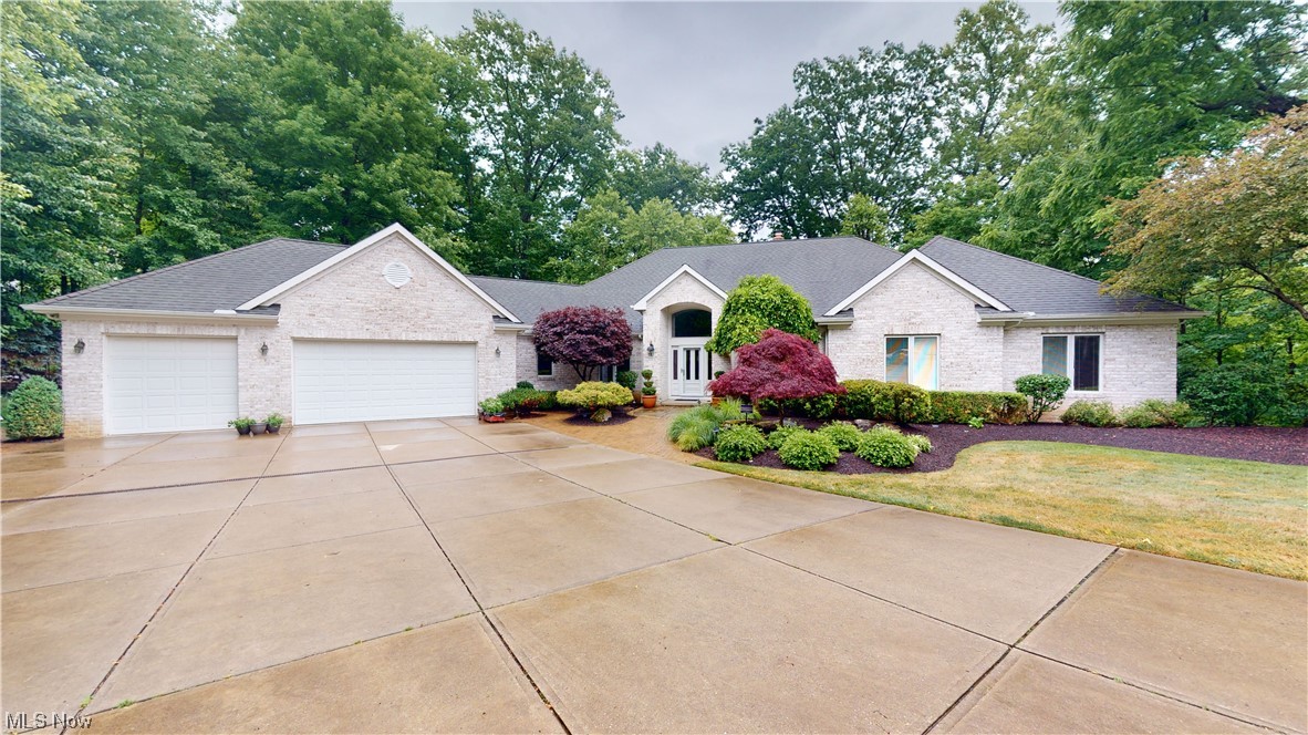 Welcome home to this stunning all brick ranch in the heart of Mayfield Village. This one of a kind home exhibits incredible craftsmanship & attention to detail throughout. The inviting foyer with limestone flooring draws you to a sizable great room. The great room offers 12ft ceilings, crown moulding, recessed lighting, ample natural light and cozy gas fireplace. The Chef's kitchen boasts a Decor double oven and 6 burner stove with granite countertops & Plato cabinets with rollouts. The kitchen also features a Sub Zero fridge, Bosch dishwasher & Maplewood flooring. The finished walkout basement is perfect for entertaining or can easily be converted into a teen or in-law suite w/ a Kraft Maid cabinetry kitchen & wet bar, plus granite countertops. The lower level full bath has a a steam shower! The two tiered, maintenance free Brazilian Palope deck overlooks a tree laden backyard! Gates Mills mailing! A must see! Agent is related to the seller.