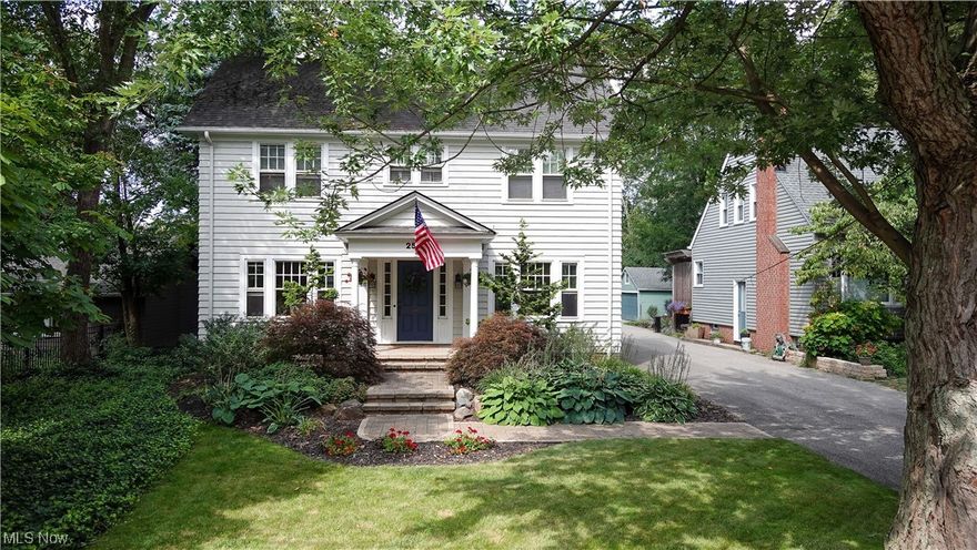 Nestled a short walk from the restaurants, breweries, and coffee shops of Cedar Lee and the beautiful homes and parks of Shaker Heights is this remarkable, light-filled classic colonial home.  Renovated in 2019 with an architectural-designed and landscaped entranceway and updated bathrooms and kitchen, this house maintains the timeless architecture of built-in wood cabinets with leaded glass doors and original glass knobs, and original wood floors. Living room features a large, wood-burning fireplace and wooden French doors that lead to a private, covered back porch. Cute, 1/2 bath is tucked under the stairs.  Center hall entrance features a grand staircase that leads to the 4 second floor bedrooms and full bath.  The primary bedroom has a unique sink and vanity, with an opportunity to extend it into a full on-suite bath.  Finished third floor can be a large bedroom or media room, with separate finished closet or storage.  Laundry shoots on both floors! Generously-sized backyard with l