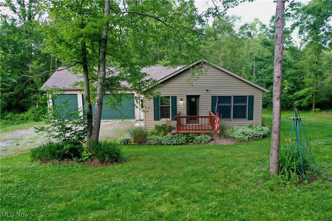 Welcome to your slice of paradise! This dreamy 1.44-acre ranch offers country vibes with Lake Buckhorn access. Stroll up to the inviting front porch and step into an airy open-concept haven, where sunlight dances through the living, dining, and kitchen spaces. Bonus: the appliances are yours to keep (Range: 2 years old, Dishwasher: 1 year old, Fridge: 5 years old, Disposal: 2 years old).
The first-floor laundry leads to a 3-car attached garage, prepped for heated floors—just awaiting to be finished. Sneak out the back deck off the garage to enjoy a front-row seat to nature's wildlife spectacle. The primary bedroom boasts a full bathroom, and 2nd bedroom and full bathroom (featuring a new tub insert) complete the first floor.
Venture down to the full walkout basement, where the utility room offers a set-up to finishing installing a half bath sink. Two additional rooms are perfect for bedrooms or home offices. An unfinished family room opens to a patio (new patio door). A trusty generator, new ductwork, NEWLY Installed Furnace and Central Air. Endless charm make this a move-in-ready gem!