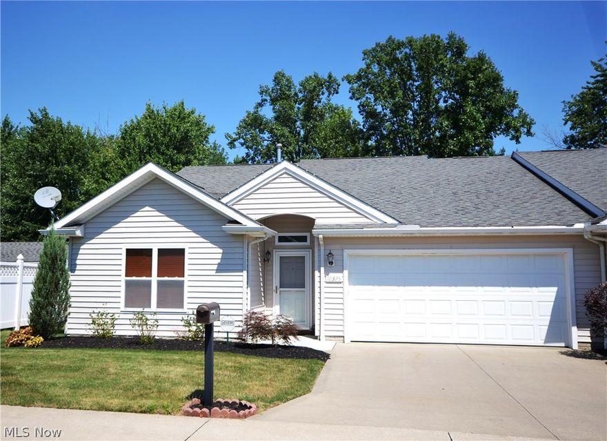 Great Location!  Built in 2008, this beautifully and meticulously maintained 3 bedroom cluster home is move-in ready!  Step into the very spacious great room/dining room area with vaulted ceilings, a stone gas fireplace, and lots of natural light.  This area can be divided as you see fit.  The bright and airy kitchen features an eat-in area, lots of counter space, stainless steel appliances and a generous pantry.  Retreat to your master suite with vaulted ceilings, a large walk-in closet and a spacious master bathroom with a walk-in shower.  The laundry room off the garage has a large closet for extra storage (dryer to stay).  This end unit home offers privacy galore!  The vinyl privacy fully fenced in yard with nature stone patio is a great space for entertaining family and friends.  Roomy 2-car attached garage, with extra common parking. Easy to show. A must see!