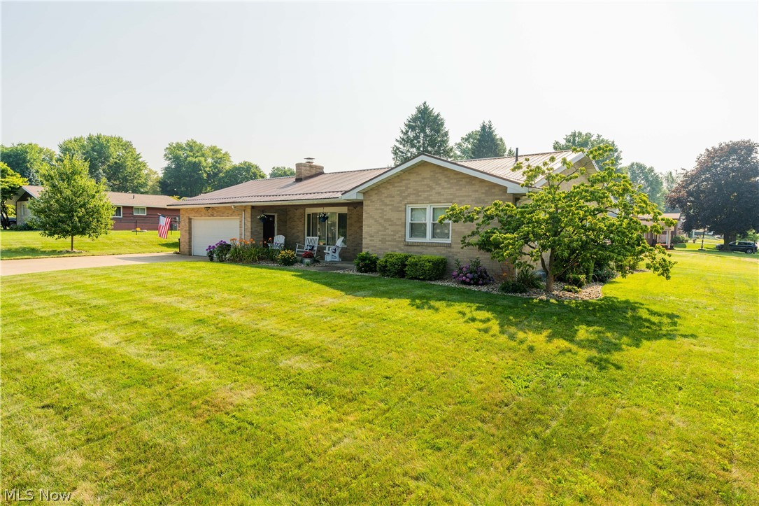 Welcome home! This brick ranch sits on a spacious corner lot just minutes from multiple golf courses. Inside you will find a spacious first floor with three bedrooms, oversized living room with a wood burning fireplace, dining room and a completely remodeled kitchen with all new appliances. The huge partially finished basement features another full bathroom, oversized laundry room and an additional room that could be used as a playroom or office. Outside you will find an attached two stull garage with plenty of storage space, a breezeway that leads to a custom patio with a built in fire pit and a nice sized yard surrounded by a privacy fence. Other features/updates include: two new steel exterior doors, Provia windows throughout most of the home, all new appliances in the kitchen, hardwood floors in the kitchen and dining room, 80 gallon energy efficient hot water tank, water softener, new metal roof and all new landscaping around the property. Sellers offering an APHW home warranty fo