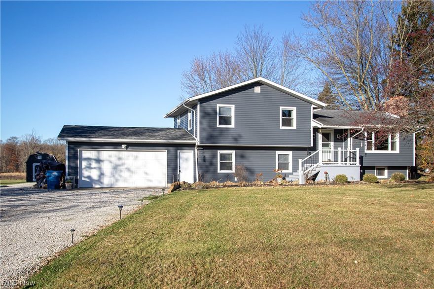 Looking for an updated home with an outbuilding on 1.5 acres? Look no further! This split level home boasts a stunning eat-in kitchen with an island and newer stainless steel appliances. It connects to the living room which stays toasty and inviting with the wood-burning fireplace. Upstairs you'll find three bedrooms and a full bath - newer carpet (2021), all new trim & hardware, and freshly painted! The finished lower level includes another full bath, LVP flooring, and room for a workout/office area, family room, or whatever you need! Big basement with lots of storage. The real stunner is the 30x40 pole barn - full insulated with electric and a garage door opener - tons of space for your vehicles and hobbies! All of this situated on a beautiful lot with farmland behind. Take a deep breath, sit back and relax in this little slice of paradise. Other recent updates to the home include A/C unit, hot water tank, roof on garage, windows, siding, flooring, and Trex front porch.