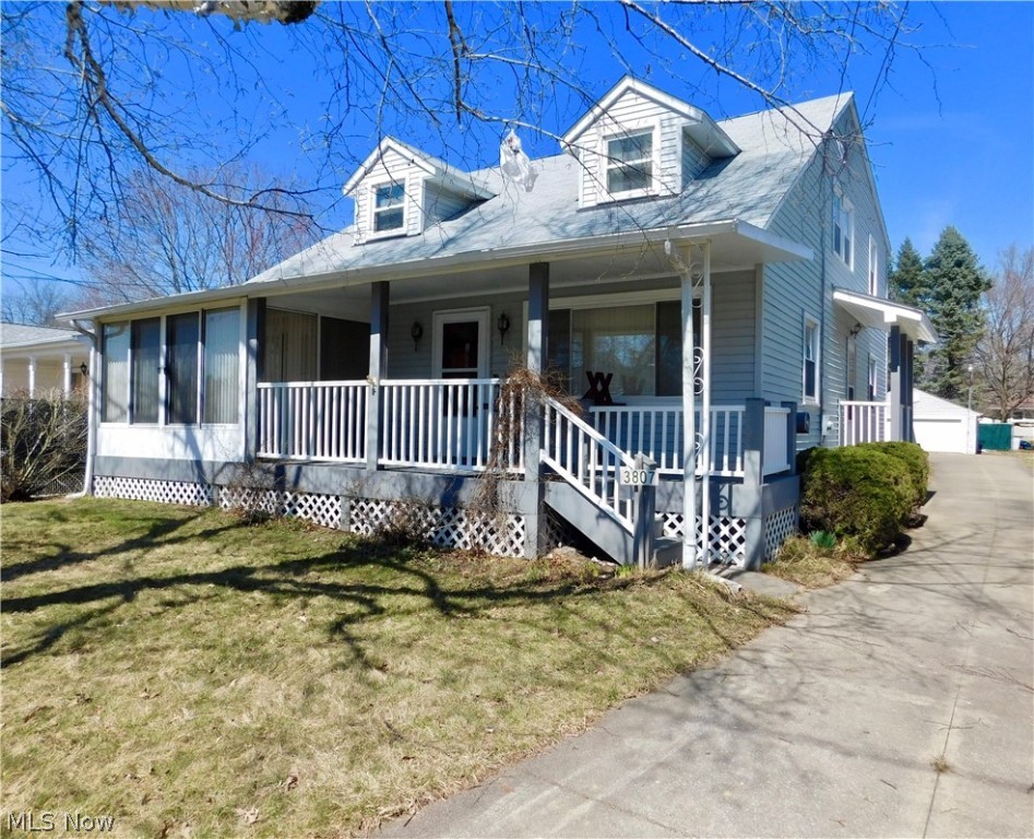 Welcome home to this lovingly maintained Cape in Mogadore! This home boasts 4 spacious bedrooms and 3 full baths un a unique layout that could be perfect for an in law sweet, teen suite or possibly a rental! The first floor offers a very large living room, kitchen, dining room 2 bedrooms and a full bath. Off the dining room is a sunny 3 season room that leads out to the front porch. The second floor includes 2 more bedrooms, a second living room/family room a second kitchen and full bath. The basement has a finished rec room, workshop laundry and another 3/4 bath! Really nice storage space throughout. Enjoy the large lot and an oversized 2 car garage with newer nature stone flooring, plus a carport! This home has so much potential and tons of space, bring your personal touch and make it yours! Home Warranty included!