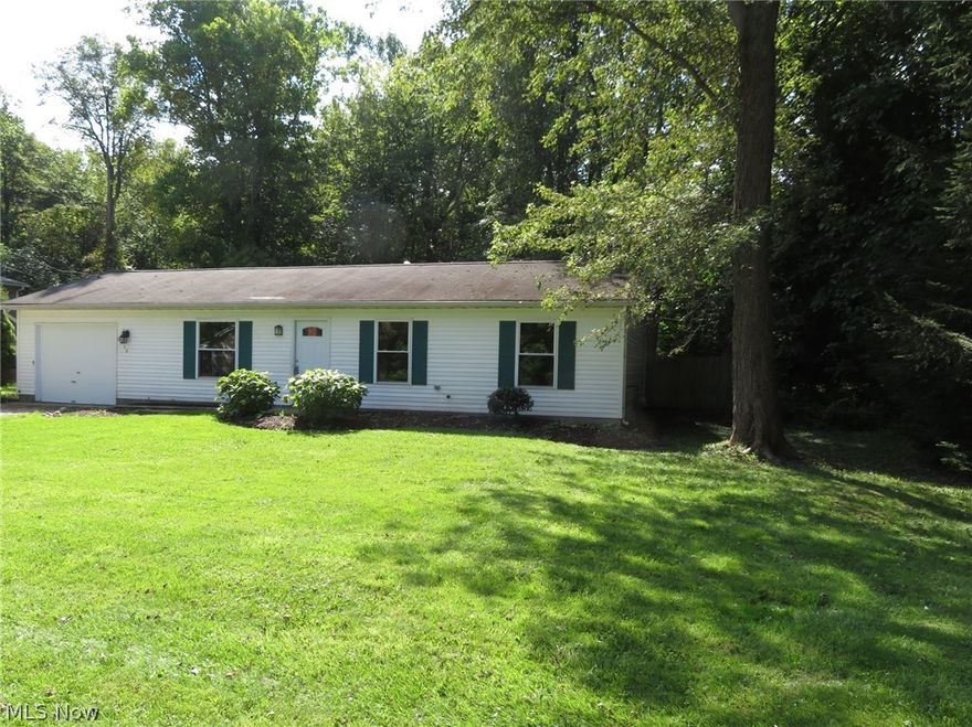 Move In Ready "Three Bedroom Ranch"   Home offers Living Room/Dining Room combination with new carpet and freshly painted.  New Kitchen with new kitchen cabinets, counter tops, and floor.  Spacious laundry room freshly painted and floor.  Three bedrooms with plenty of closet space freshly painted and new carpet.  Bathroom freshly painted, new floor, new vanity, mirror, and light.  One car garage with door opener.  Home also has new gas furnace and central air conditioner.  Large double lot with spacious backyard which is fenced and has a cement patio.   Located close to Lake Erie for the summer breeze, restaurants, shopping, medical and more.  Tax assessment $42.00 storm sewer