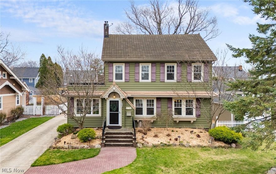 Welcome to 2135 Riverside Dr! An elegant home that beautifully captures the timeless charm and character Lakewood is known for. From the moment you arrive, you’ll be drawn in by its inviting curb appeal, rich original woodwork, and stunning architectural details that speak to the home’s history and craftsmanship. Hardwood floors flow throughout, adding warmth and continuity, while the setting—on a picturesque, tree-lined street overlooking the valley of the Rocky River Reservation—offers a truly special backdrop. The welcoming foyer opens to a spacious living room centered around a striking fireplace with a wood mantel. Crown molding highlights the architectural detail, while hardwood floors add warmth. A cozy sunroom offers the perfect place to relax or work from home. The formal dining room features stunning built-in cabinetry, adding both charm and function. The kitchen blends classic style with everyday convenience, offering rich wood cabinetry, deep-toned countertops, stainless steel appliances, and a tiled backsplash. A charming breakfast nook provides the perfect spot for casual meals. A mudroom and half bath complete this level. The second floor offers three spacious bedrooms, including one with access to a beautiful rooftop deck—an ideal retreat for relaxing evenings under the stars. The full bath blends vintage and modern finishes with a timeless feel. The third floor is dedicated to a private owner’s suite, featuring vaulted ceilings and original built-in drawers that add both character and function. A full bathroom with a beautifully tiled walk-in shower completes this inviting retreat. The walk-out finished basement adds additional living space with a large rec room, a full bath with a soaking tub and walk-in shower, plus laundry and storage. Step outside to a fenced-in backyard designed for both relaxation and entertaining, complete with a tranquil pond, patio area, and carport. A detached two-car garage adds convenience to this truly special home