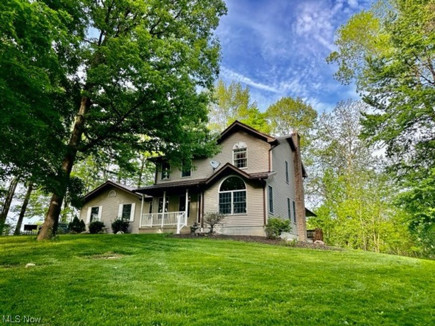 Check out this Tuslaw colonial on 5 acres! A perfect blend of wooded seclusion with wide open yard space. This home sits tucked back from the road with SO much to offer. Host watch parties in the theater room. It comes complete with optimum 5.1 Surround Sound and a 100” near-projection video system with mounted screen and is virtually sound proof from the rest of the house. Remote accent lighting sets the perfect mood for movie nights as well.The basement boasts a large rec room, a rustic wet bar with accent lighting, and a full bathroom with walk-in shower. The outdoor space is simply incredible. Watch the kiddos playing in the spacious yard or catch the jaw dropping sunsets on the large wrap around deck. The barn/shop features a concrete floor, natural light, and electric, for a DIYer's convenience. There's so much to offer here, just come add your personal touches and make this house your home.