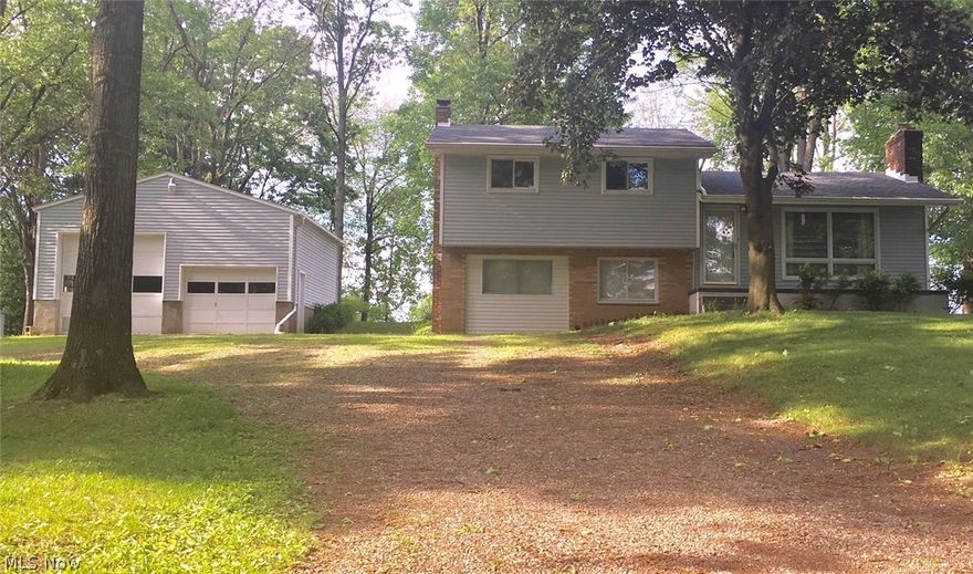 Welcome home! Located on a private quiet street in Green is this well maintained home. Amazing 24 x24 detached garage with standard and extended height garage door. Beautiful yard with mature trees, shed in the back for storage and a great deck for enjoying the beautiful summer days. The interior of the home is a spacious split level, wood burning stove in the family room, brick fireplace in the living room, spacious eat-in kitchen and 3 nice sized bedrooms with hardwood floors. The roof was replaced fall 2015. Home Warranty is included.