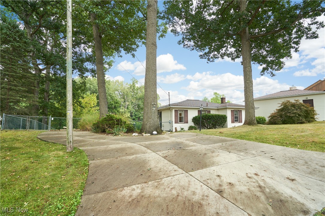 Great Portage Lakes location! Walk out ranch on the channel with access to main lake. Call to see this 2 Bedroom , 2 bath home with awesome backyard , with over a half acre setting. This home's kitchen has pickled oak cabinets in the kitchen ,fully applianced, with peninsula bar and dinette. The Living room is carpeted and wood french doors leads to the sun room with views of the yard and the channel water . The lower level has a large family room with a built in wet bar, a gas fireplace and laminate flooring. There are sliding glass doors in the family room that leads to the large wood deck and fenced yard. There is full bath with shower located off the family room. The sea wall has been rebuilt and the concrete steeps leading from the drive are newer also. Large 2 car garage with vinyl siding was built in 1998. High Efficient furnace and air in newer in approx 23. Septic replaced in approx 2010. POS completed for both well and septic - waiting on paperwork from county