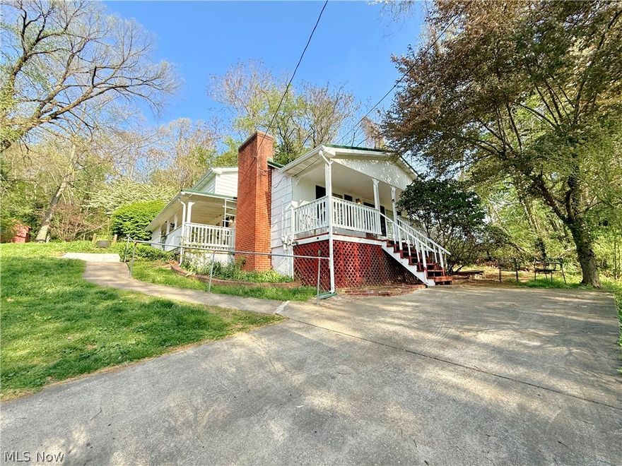 Own your own little acre of paradise with this 3 bedroom, 2 bath Belpre home. Tucked on a quiet wooded lot, this property offers the peaceful setting you have been craving while still being just minutes from town, State Route 7, and the West Virginia border. A detached garage, large workshop, extra parking, and an additional outbuilding provide all the space you need for hobbies, storage, and everyday convenience. You will also appreciate the metal roof along with an updated HVAC system and hot water tank for added peace of mind. Priced to sell and ready for your personal touch, this is an opportunity you do not want to miss. Tour it quickly before it is gone.