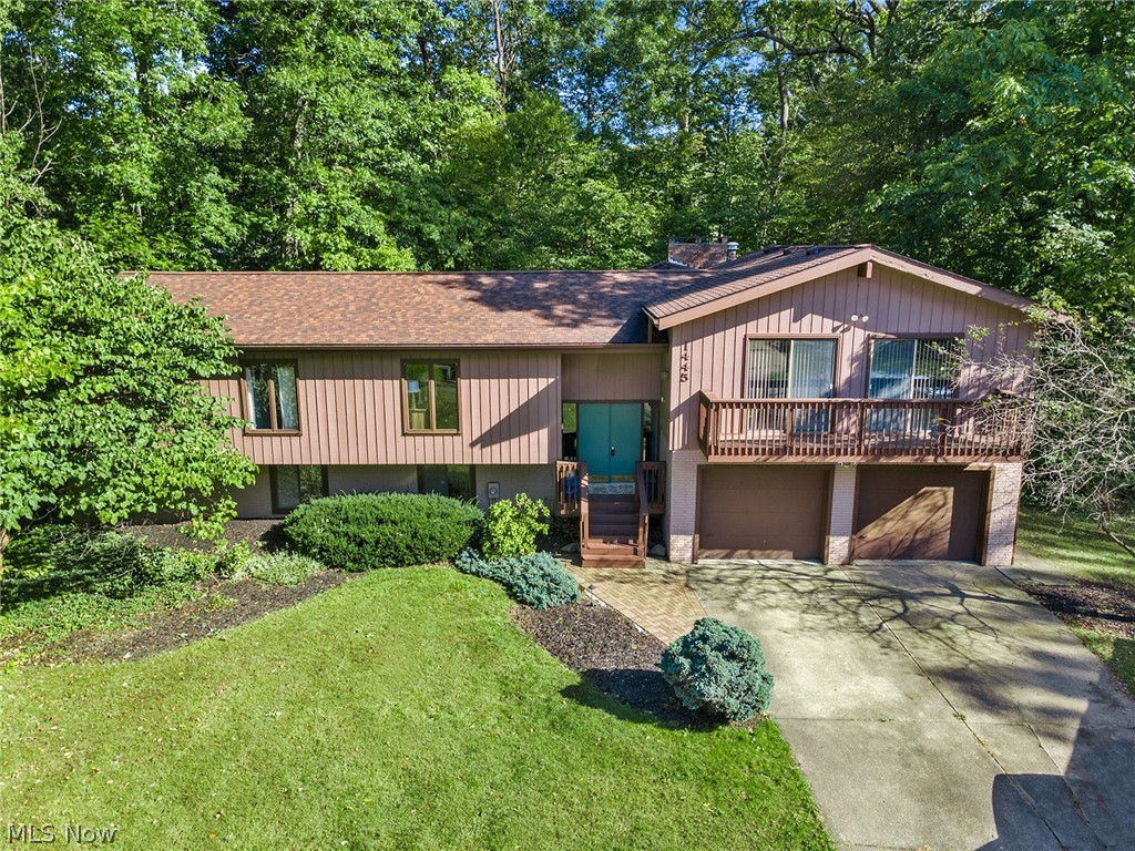 This home is a must see!! Dont miss this wooded oasis convenient to everything! Desirable end of the cul de sac location with a spacious and private lot. Walk into the main level of the home and enjoy vaulted ceilings throughout. Upon entry you'll find a welcoming foyer, leading to a spacious living room with dual sliders to a sunny deck. From there you'll find a large formal dining room that leads to a spacious eat in kitchen with island. Vaulted ceilings connect the space to a welcoming and cozy family room with a gas fireplace and sliders to the serene and private back deck. Down the hall on the mail level is the spacious owners suite with walk in closet and en suite full bathroom. The main level is completed with an an additional 2 large bedrooms with excellent closet space and an additional full bath with large walk in shower. The walk out lower level offers an exceptional additional 2 large bedrooms, a full bath, and a SECOND family room with fireplace and sliders out to a b