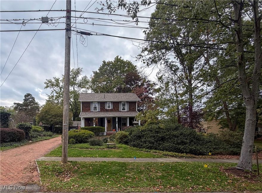 This charming and historical colonial home is ready for the next owner to enjoy all it has to offer. A welcoming front porch leads into the living room which is open to the dining room, where you can sit and take in the view to the beautiful backyard with a park like setting. Also on the main floor, is a family room with a beamed ceiling, the master bedroom with a walk-in closet and full bath nearby. Upstairs, there are two additional bedrooms and bath where you will find original hardwood. Outside, follow the brick driveway up to a path that leads through the lush garden with trees and flowers. There is a two-car garage with a bonus room behind it that has electric and heat. It can be used for a play room, craft room or extra storage space. The location is ideal, as it is within walking distance to the library and schools. Schedule a showing to see this unique home today! Updates - 2023: roof, 2005: windows.