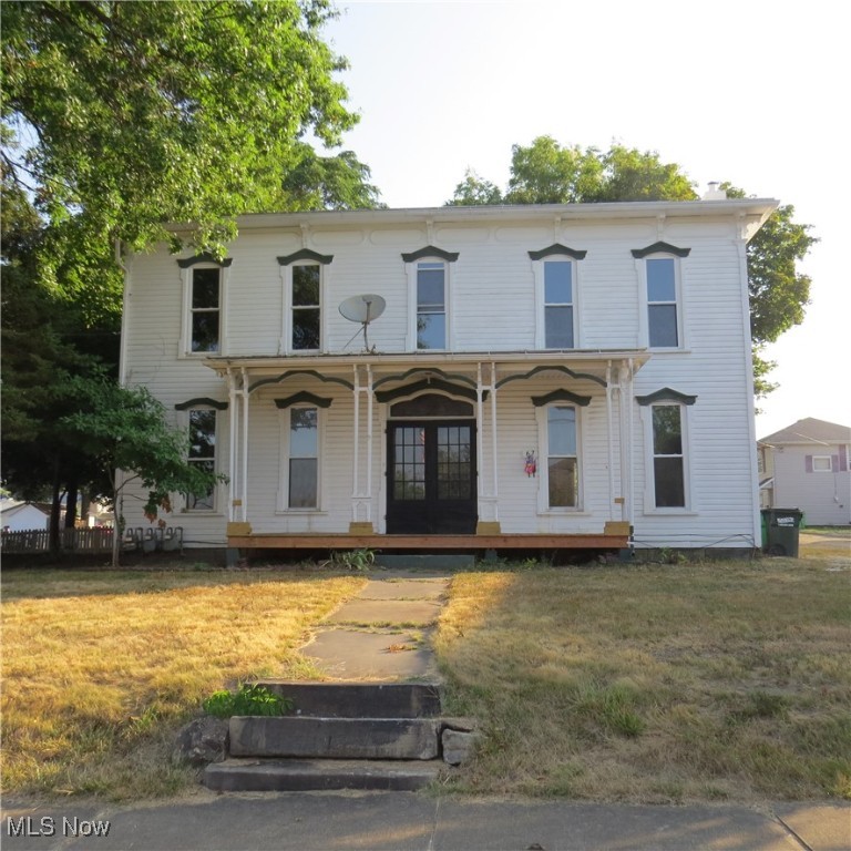 Century 2-Story House in Carrollton. Most recently rented as a 3-unit structure, this dwelling is listed on the tax card as built in 1890 and has over 3000 sq. feet above grade. The house features high ceilings, wood floors, 4 non-working fireplaces, and a wonderful main foyer with stained glass window over the entryway. This has been a rental for the past 30 years. Update it as a rental or convert back to a historic family residence. Situated on a level 60'x207' lot served by village water and sewer and located across the street from the library and near the downtown. Call to schedule your viewing and start imagining what your dream is for this home!