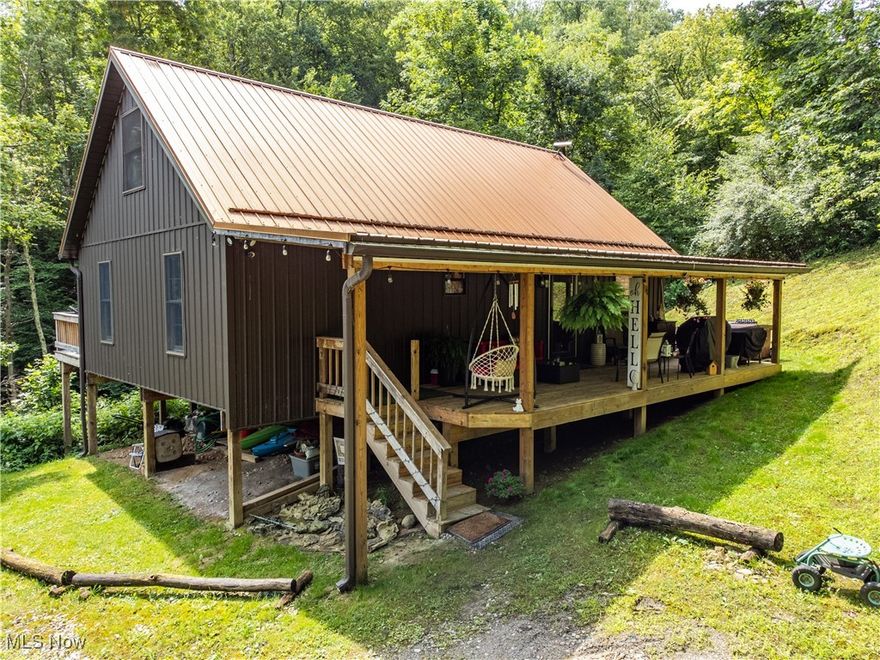 Welcome to your peaceful retreat in the woods! This custom-built Amish cabin can be your turn-key Oasis, completed in 2020, sits on 6.25 private acres and offers the perfect blend of rustic charm and modern comfort. Constructed using timber and wood sourced locally, this 3-bedroom, 1-bath home is truly one-of-a-kind.

Tucked away among mature trees, the cabin is nestled beside a meandering creek fed by a natural spring—a serene backdrop for relaxing, exploring, or enjoying nature’s quiet beauty. A brand-new walking bridge, built in July 2025, makes it easy to cross the creek, leading to your private deck overlooking the water—an ideal spot for morning coffee, relaxing, or entertaining friends.

Inside, the cabin features handcrafted woodwork, a pellet stove for cozy winters, and window A/C units to keep you cool in summer. The kitchen includes all appliances, and the layout offers an efficient use of space while maintaining a warm, welcoming atmosphere.

Outdoors, you'll find a two and a half-car garage, plumbed for floor radiant heating and a large shipping container for extra storage—perfect for tools, gear, or seasonal equipment. With abundant wildlife and dense forest, this property is also a hunter’s paradise.

If you're searching for privacy, self-sufficiency, and a deep connection to nature, this property delivers. Mineral Rights are not owned so they will not transfer. Contact your agent today and schedule a showing!