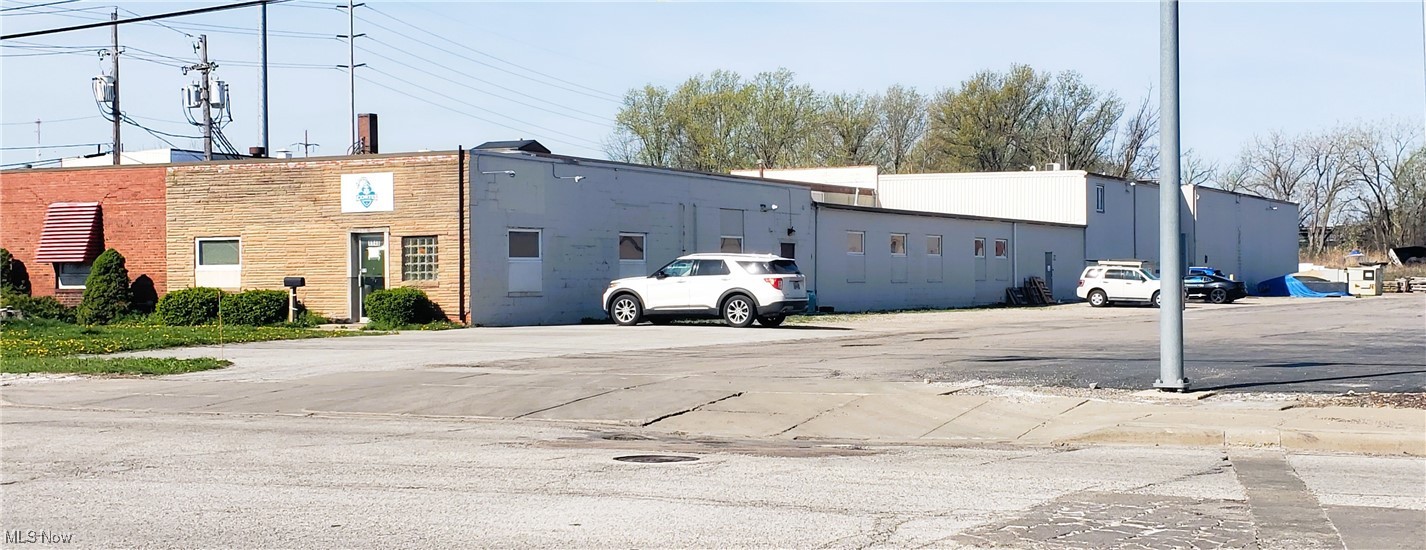 Industrial/warehouse property with office space and mezzanine space directly across from the Lincoln Electric World HQ in Euclid, OH. Ceiling clear height is ten feet in the front half and eighteen feet in the back half of the building. Zoned U-6 light industrial. 480 Amp/240 Volt/3 Phase power present. Two 10'x14' drive-in doors.