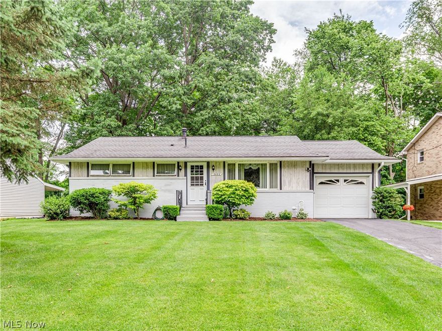 Charming 3 bedroom 1 bath ranch home located in Plain LSD.  Walk into the living room with a picture window overlooking the front yard and unique brick planter.  The eat-in kitchen has wood embossed kitchen cupboards, double sinks and room for a nice sized dining table.  The family room is adjacent to the kitchen and boasts a beautiful brick hearth wood burning fireplace, beamed vaulted ceilings and access to the back patio.  There are three bedrooms all with large closets and a full bath on the main level.  The lower level is perfect for entertaining with a bar and plenty of room for anything that suits your needs.  This home sits on a lot that has beautiful woods in the back for privacy and enjoying nature.  Please contact us today to schedule your own private showing and to make this house your home.