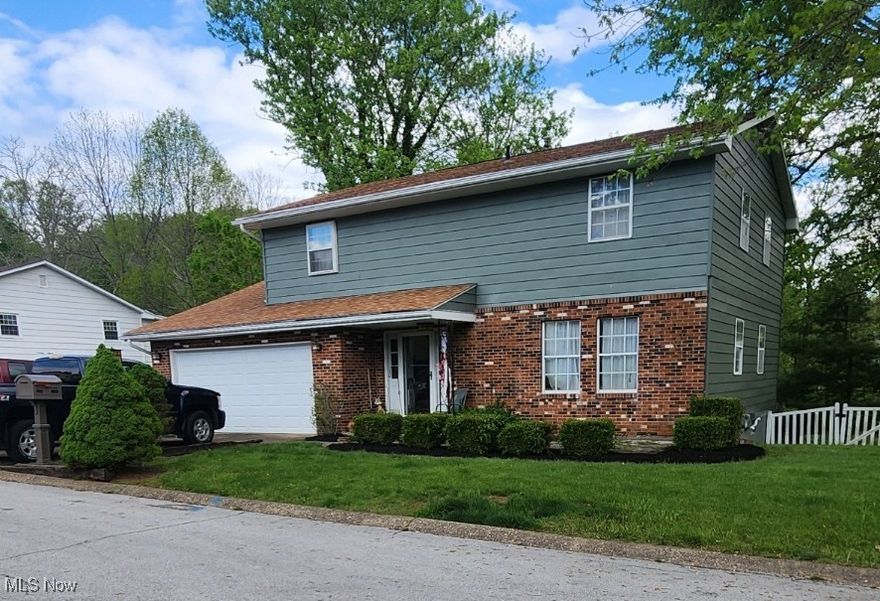 Don't Miss This Opportunity! Sellers are relocating and will entertain offers. A Home That Has It All! Nestled in an A-1 Neighborhood, you'll find this beautiful 4-bedroom home offering 2 full baths, and 2 half baths. The Oversized kitchen boasts 2 ovens, island with bar stool seating, and open concept setting room with wood burning fireplace. Adjacent to kitchen are the formal dining and living rooms with beautiful crown molding. The private deck offers the perfect place to have your morning coffee while enjoying the backyard scenery. The walk-out basement offers a wet bar with plenty of cabinets for extra storage, and a spacious game room. This is a must-see property. Call today for your private viewing.