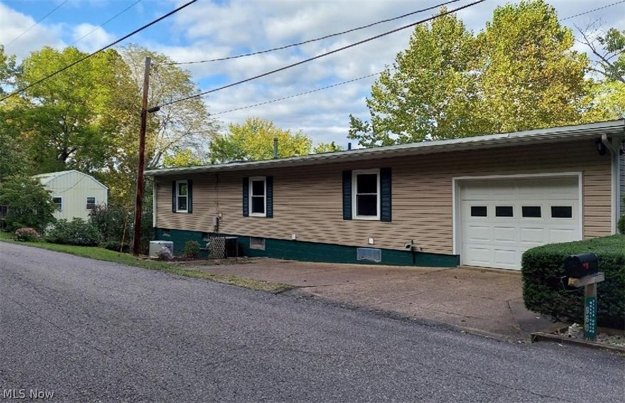 If you have been looking for a home with riverfront property, here is the place for you!!  This 3 bedroom, 3 bath home sits on almost 1.5 acres.  There are 2 attached garage bays and a 20x14 two-story detached garage/building that could be converted to additional living space, storage, workshop, or recreational area.  There is a very large upper-level deck with a SunSetter awning that is perfect for relaxing, entertaining, and watching river life.  On the lower level, there is another spacious deck that surrounds the above-ground heated pool.  From the walk-out basement, there is a partially fenced-in backyard that is great for pets and/or children.   There is a dock on the property and with a little TLC, you would have immediate access to the Muskingum river for kayaks, jet skis, or small boats.  A newer metal roof, remodeled basement in 2019, fresh paint, maple kitchen cabinets, gas fireplace in the living room, and a Generac generator are some additional features of this home.  Let's make your dream of living on the river a reality!  Call for your private showing!