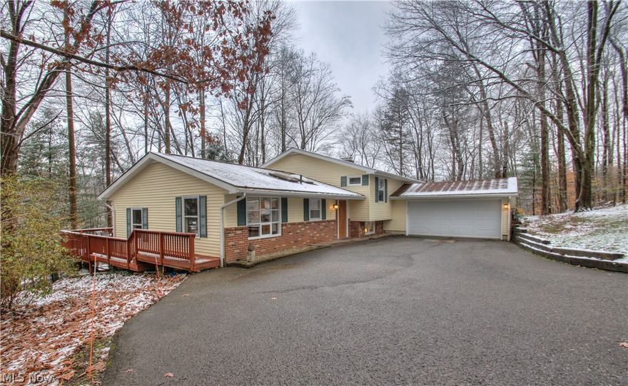 Move in ready 4 bedroom, 2 1/2 bath split level home located in the sought after Lake Lucerne community! Updated kitchen featuring stainless steel appliances, skylight and gourmet island. Open floor plan in the step down combination family and dining room areas. Beautiful views from every room! Bonus second family room with all brick gas fireplace and new carpet. Private oversized deck and brick patio overlooking a beautiful wooded lot. Recently remodeled master bath. This family friendly community has so much to offer! Lake Activities, swimming, basketball, hiking and more! Must See! Make your appointment today!