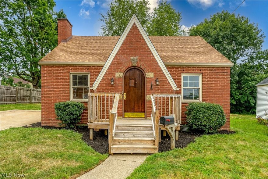 Charming brick bungalow with many updates throughout in Plain LSD.  Before you step inside this home, take a moment to embrace the gorgeous front door - so much character and pure beauty!  Inside is a small foyer (with closet) that leads you into a large great room with a wood-burning fireplace, new flooring and fresh paint.  There is a dining room (also with new flooring and paint) that takes you into the gorgeous, updated kitchen with stainless steel appliances, gray cabinets, and stone/tile backsplash.  Completing the main level is two bedrooms (brand new carpet and paint) and a full bathroom with shower/(jetted) tub combo and vinyl tile floors.  Upstairs is a massive bedroom (11x17) with a 9x10 bonus/flex/walk in closet room.  The basement has a 12x24 rec room with bar that would be perfect for entertaining.  One car attached garage and extra wide driveway as well.  Backyard has cement pad/patio and plenty of room to run around.  Conveniently located with easy access to the highway