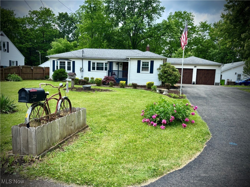 Nestled on a spacious lot, this 1957's Ranch contains 3 bedrooms, 2.5 bathrooms, timeless charm, thoughtful updates and views out back of the Mahoning River. It's perfect for those seeking comfort, space and versatility. Step inside to a warm & inviting interior, freshly painted just 3 years ago. The full bathroom in the main house was tastefully remodeled 5-6 years ago, adding a modern touch while preserving the home's original character. Major updates include: newer windows (approx 8 yrs old); furnace (4 years old) & C/A (approx 8 years old); and a roof that's approx 10 years old. The attached 2 car garage has doors that were replaced just 3 years ago and the driveway was sealed around the same time - helping to ensure peace of mind for years to come. A true standout feature is the impressive 2,000 sq ft outbuilding , which offers incredible functionality & income potential. One side hosts a spacious apartment - perfect for guests, extended family, or rental income - while the other side boasts a full workshop/garage with concrete flooring, ample workbenches, and generous storage space. Enjoy your morning coffee out back with tranquil river views, and appreciate the privacy & possibilities this unique property has to offer. So, whether you're looking to expand, invest, or simply relax in a peaceful setting, this home has something for everyone! The detached garage/workshop & apartment can be rented out entirely (the workshop can hold RV's/campers, antique/sports cars, motorcycles, boats, etc. There are several high doors for ease of loading larger items for storage. Call today for your private showing!