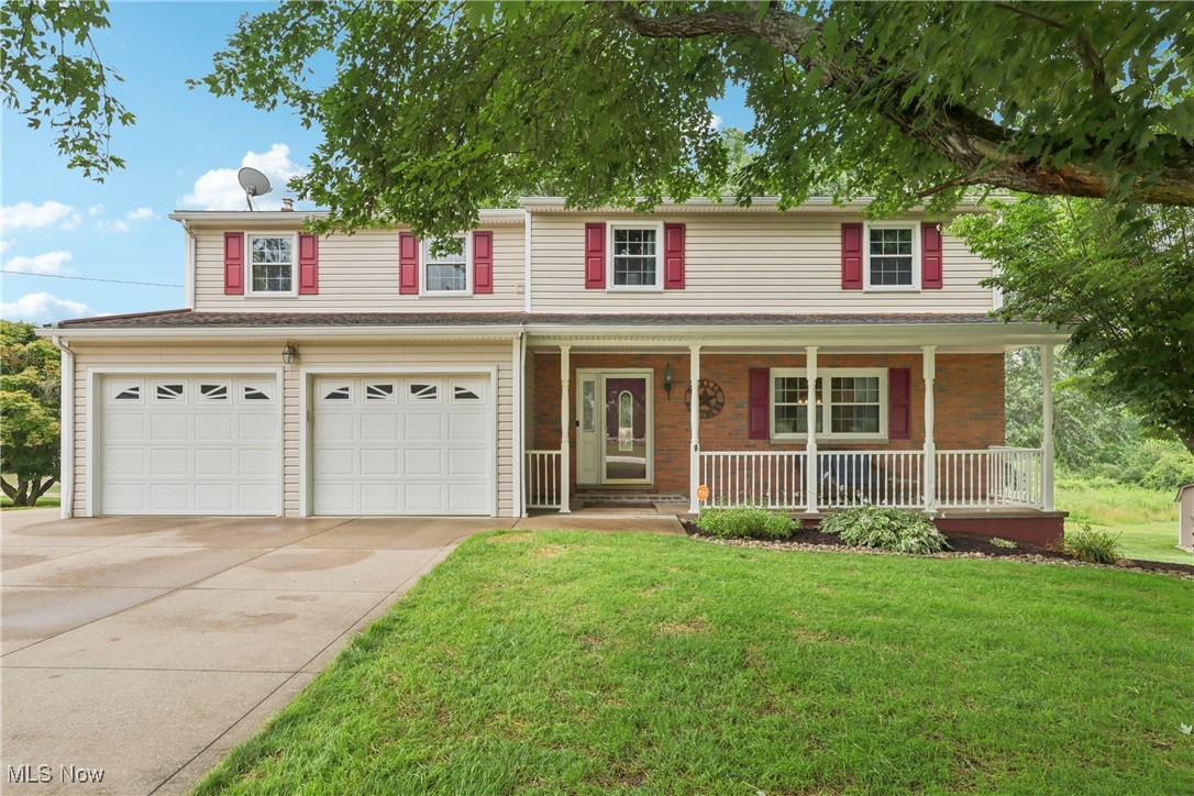 Welcome to this beautifully maintained 4-bedroom, 2 full and 2 half bath home, owned by the same family for over 30 years. Situated on a generous corner lot, this home showcases quality updates, versatile spaces, and true pride of ownership. The welcoming foyer opens to an updated kitchen with granite countertops, tile backsplash, and tile flooring. A breakfast bar connects to the living room—perfect for entertaining. Hardwood floors flow through the living and dining rooms, with built-in corner cabinets and a sliding door to the backyard deck. At the rear, the cozy family room features built-in bookshelves, a wood-burning fireplace, and access to the attached 2-car garage, which includes water, storage cabinets, and a half bath off the back hall. Upstairs, find four well-sized bedrooms with ample closet space. The main bathroom includes a jetted tub and tiled surround. A fifth bedroom has been converted into a large laundry room with built-ins and folding space. The primary suite offers a private balcony, walk-in closet, and an en-suite bath with double vanity and tiled walk-in shower. The finished basement provides a rec room with a custom oak bar (Harley-Davidson engraved), another half bath, extra storage, and sliders to an enclosed patio room—formerly a hot tub space—featuring electric, built-in speakers, and a ventilation fan. Outdoors, enjoy the 2023-built deck with covered pavilion, lighting, electric, and dual stair access. A standout feature is the 32x24 detached 3-car garage with electric, gas heat, water, its own hot water tank, and built-in cabinets—ideal for hobbies or storage. Two concrete driveways (one off Juniper) and a drainage system enhance functionality. A large shed with loft and electric adds even more space. Recent updates include a 2019 water softener and completed well/septic inspections. A 1-year home warranty is included for peace of mind. Don’t miss this rare, well-cared-for home—schedule your private showing today!