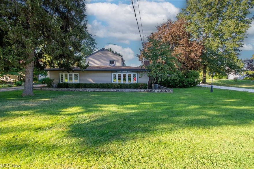 Don't miss your chance to see this unique property! Featuring a large first-floor addition with a family room, bar area, master bedroom & master bath with a walk-in shower has everything you need on the main floor. The kitchen has new stainless appliances (gas stove, 1 year & fridge, 6months), a second living room with backyard covered patio access and a dining room. On the second story you will find a full bathroom with a jetted tub, 1 bedroom with extra loft style storage, and a larger bedroom that was one time 2 rooms and could easily be converted back. This well-loved home has many features including: 2 car garage, an extra garage with carport parking and a workshop, An acre of land with many unique flowers, Apple & Pear trees, Newer Roof, Gutter Guards, Battery Backup Sump Pump, New Well pump & Water Softener system (2023). The Septic was replaced in 2012 and is currently on a county operating permit.