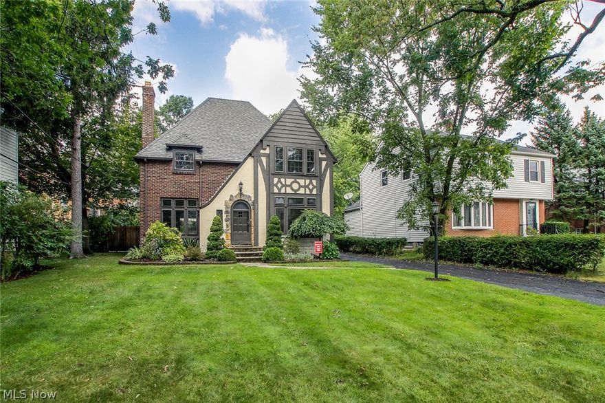 A one of a kind three bedroom brick and stucco Tudor in University Heights! The first floor features a spacious kitchen with granite counters, glass and stone back splash, stainless steel appliances under cabinet lighting. Living room has leaded glass windows, a gas log fireplace and french doors to a beautiful and spacious office/computer room. The dining room offers a built in corner china cabinet. Plenty of natural light in every room! The second floor has 3 bedrooms with an updated full bath. Master bedroom has his & hers built in closets. There are hardwood floors throughout first and second floor. Completely refinished lower level perfect for a family room/playroom/media center. Brand new 2 car garage and storage shed. This home is not only charming but the recipient of University Heights’ most beautiful home award! Stunning both inside and out!