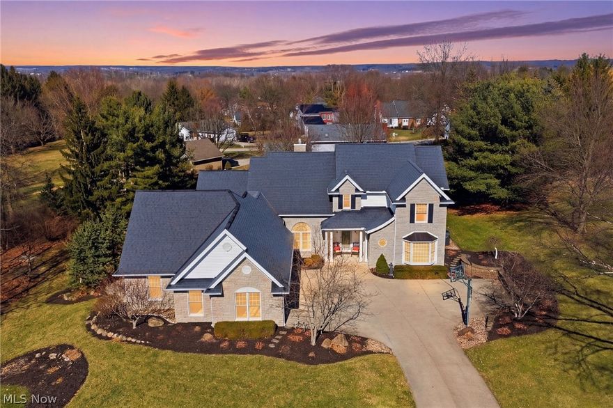 Welcome to this premier Ashland property, perfectly situated on the 15th fairway of the Ashland Golf Course. Spanning 1.2 acres, this meticulously built and maintained home offers 4 bedrooms, 3 full bathrooms, 2 half baths, over 3,400 square feet of elegant living space - plus a finished walkout basement, ideal for multi-generational living or extended guest stays. Step inside to a breathtaking entryway that opens into the gracious living and dining rooms, where a double-sided fireplace creates an inviting atmosphere for gatherings. The gourmet eat-in kitchen with ample space for casual dining flows seamlessly into the wrap-around sunroom, where you can enjoy sweeping views of the tiered deck and lush golf course beyond. The main level boasts a luxurious primary suite complete with a private study, providing the perfect retreat for work or relaxation. An additional main level office can easily serve as a fifth bedroom to accommodate guests or growing families. The three-car garage offers ample parking and includes an extra storage room for all your needs. This exceptional home combines timeless craftsmanship, thoughtful design, and an unbeatable location - truly a rare opportunity in one of Ashland's most desired neighborhoods.