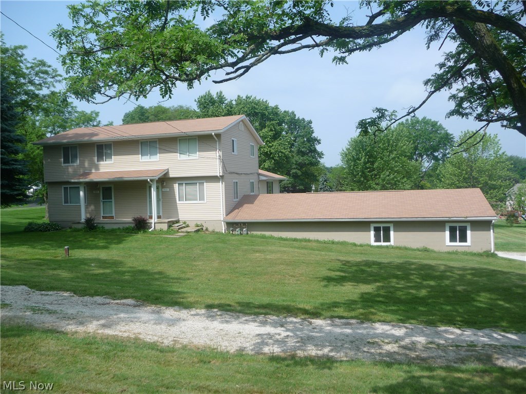 Replaced roof/gutters/siding in 2007, pool liner 2015. (3031 side): 3 BR, 1.5 BA, living room, kitchen, 1 car garage, central air, basement. (3033 side): 3 BR, 1.5 BA, dining room, eat-in kitchen, great room with fireplace, 1st floor laundry, recreation room, office, central air (2015), huge attached 4 car garage. All flooring replaced in 2015, interior freshly painted in 2015. 1.5 acre lot w/in ground pool. Includes 1 year home warranty.