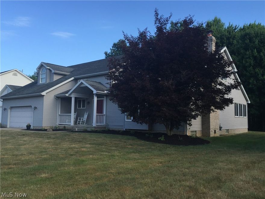 This quality built home is custom designed. The ceramic tile foyer opens to large living room with vaulted ceiling, recessed lighting, and floor to ceiling fireplace. There is also a view of the 2nd floor walkway. Large windows provide lots of natural light. New flooring in livingroom and dining room.  French doors open from dining area to sunroom with 2 skylights.   Kitchen includes an island with seating area, pantry for storage, and desk area. Family room provides more space for entertainment.  Large laundry room  and half bath are conveniently located on 1st floor.  Open stairway and walkway lead to 2nd floor.  Master bedroom suite has private bath with skylight, whirlpool tub, double walk in closets.  There are 3 additional bedrooms and guest bathroom also with a skylight. Full basement provides storage space and can be finished for additional living space. Natural gas furnace and central air for comfortable living all year.  Oversized attached garage includes 771 sf of space for