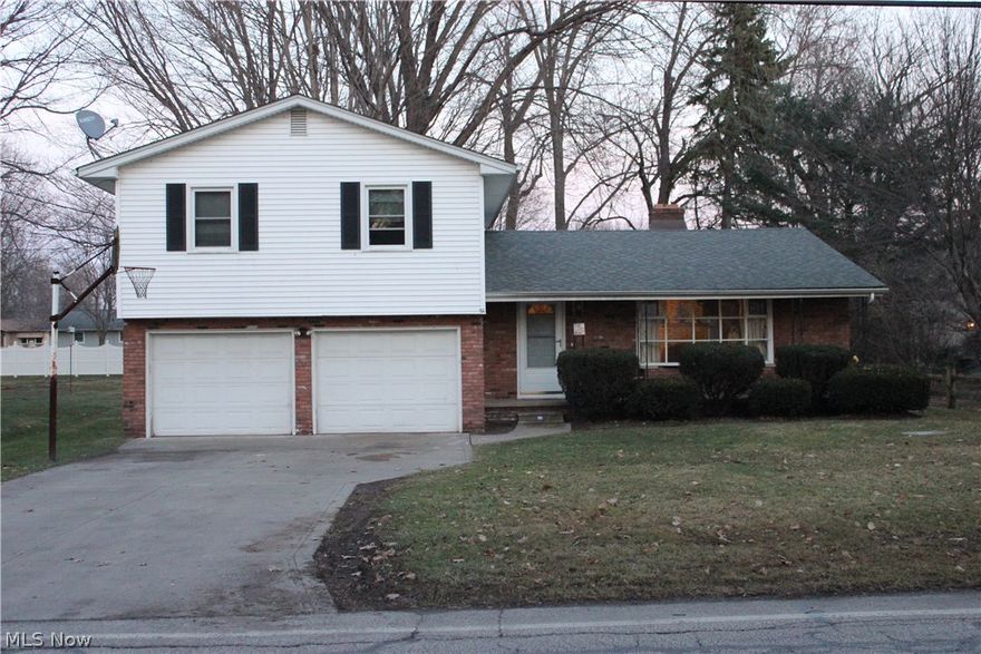 Walk right in, and you’re already home! This charming split-level has everything you need and more! The spacious open living area between the living room and the dining room features a unique corner fireplace and tons of natural light. The fully updated kitchen (new countertops and cabinets 2011) is sure to impress with granite countertops, solid maple cabinets and modern laminate flooring. Off the kitchen is a second living area, with access to the backyard patio through a sliding glass door. The upstairs boasts hardwood floors, 2 full bathrooms and 3 bedrooms. The master bedroom includes plenty of closet space and a private bath. The remaining 2 bedrooms are also large and have generous closets. Downstairs, a full basement provides plenty of space for whatever you need; storage, a workshop, recreation, and/or an exercise area. You decide! The attached 2 car garage provides even more opportunities for storage or workshop areas. The house sits on a 5/16 acre lot with a generous backyar