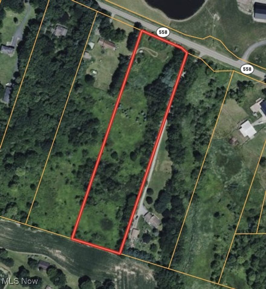 This is a 5 acre building lot in Fairfield Twp and Crestview Schools with a lakeview across the road.  The property already has a "h" shaped driveway and is ready to build. Agent owned