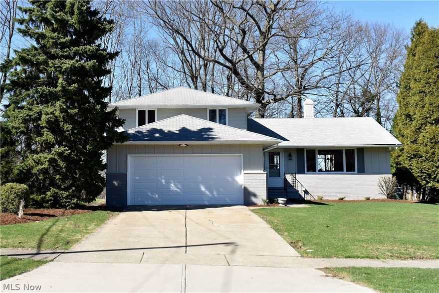 Come visit this Move-in-Ready Split Level tucked away in the Heart of Seven Hills.  The Kitchen is the Jewel of this Home and a Chef’s Dream.  The space features the Highest Quality Craftsmanship with Stunning USA made Full-height Cabinets, Granite Countertops with Undermount sink, Huge Entertainer’s Island, and New stainless-steel appliance package compliments of the owner.  The restored hardwood floors are matched with Life proof Luxury plank vinyl, ceramic tile and fresh carpet.  New lighting, hardware and faucets are featured throughout this beautifully modernized home.  The ground level has a bedroom with adjacent full bath that would be great for first-floor living or a private office.  The brand new sliding door looks out into the serene backyard and floods the family room with natural light.  Upstairs there are three generously sized bedrooms updated with premium two-panel doors and new wood trim.  The Guest Bath is highlighted by an Amazing Granite Double sink counter Top and