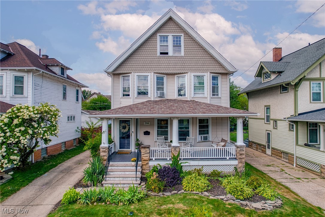 Absolutely Stunning Home on One of Lakewood’s Most Sought-After Streets. This picturesque stretch of Andrews Avenue is ideally situated between downtown Lakewood’s vibrant retail and dining scene, the recreation and green space of Kauffman Park, and just southwest of Lakewood Park, meaning Lake Erie sunset strolls are only two blocks away. The street itself is lined with charming, well-crafted single-family homes and welcoming neighbors that embody Lakewood’s sense of community. Inside, the inviting foyer is accented by lovely original tile the rich woodwork will wow you throughout the home. The expansive living room boasts a large bay window and a cozy gas fireplace framed by elegant built-ins. The formal dining room is a showpiece with beautiful wainscoting and original built-ins. Through classic French doors, enjoy access to a back deck overlooking lush landscaping, firepit and a fully fenced yard - ideal for entertaining, gardening or relaxing. The updated kitchen is a marriage of style and functionality, offering stainless steel appliances, granite counters, center island and abundant storage and prep space. Convenient first-floor laundry room and chic half bath add modern practicality to the historic charm. Upstairs, find four generously sized bedrooms with ample closet space, including one with a private balcony with backyard views. The full bath has been tastefully updated, and the walk-up attic provides impressive storage or the opportunity for future expansion. The professionally waterproofed basement offers additional storage and flexibility for hobbies or a workout area. Boiler ('13), H2O tank ('25), washer/dryer ('16), updated electric ('23), garage door ('18). Vinyl windows throughout enhance the beauty and energy efficiency. 2 car garage with additional storage! From its timeless architecture to its thoughtful updates and unbeatable location, this home delivers. Ready for you to move in and start making memories.