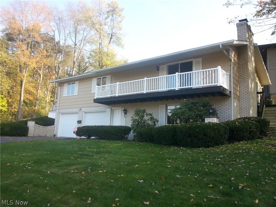 Lots of potential in this bi-level w/walk out basement. Overlooking Lake Cable-view of the lake from the living room, family room & all bedrooms. Side & front decks also offer wonderful views of the lake. Updates include: furnace & central air 2015, hwt-2012, 2 car oversized heated garage w/ newer garage doors & attached finished and heated bonus room.