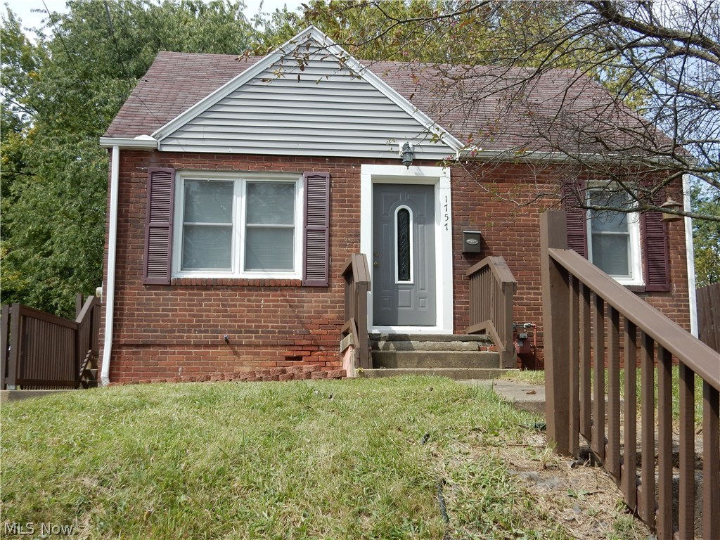 Cute, cute, cute! This adorable, tastefully updated and move-in ready all brick bungalow is perfect for the first time home buyer or the down-sizer. Seller's have done it all for you, just pack your things and move in. You will appreciate the many updates. Electric updated (2008) with 100 amp service. Kitchen with updated flooring, counters and cupboards. Living room with fresh paint (Aug. 2017) and laminate flooring. All bedrooms offer ample closet space with the upstairs bedroom having a bonus area. Beautifully updated bathroom with tile shower surround and a dual head shower. No need to purchase appliances, the range, refrigerator, washer and dryer remain with the home. All windows have been updated as well, and sellers are leaving the two window a/c units. The large 25'x23' basement offers plenty of storage space and has glassblock windows. Outside, you will find all wood areas have a been freshly painted and the large back yard is fenced. The new curtains, mini blinds, rugs and s