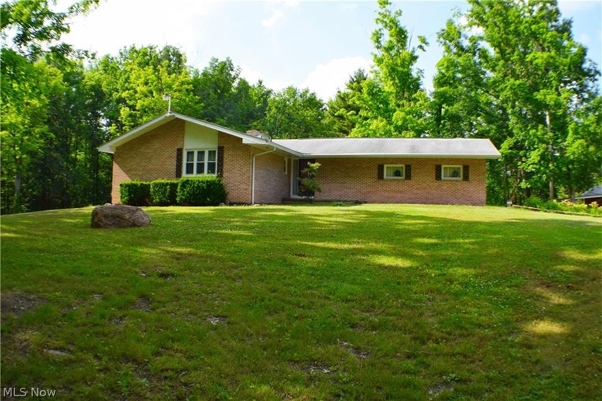 Solid brick ranch home on 14 acres of land in West Farmington. This well built 2 bedroom home features living room and dining room with a shared fireplace. Eat in kitchen with all appliances. Full basement partially finished with a fireplace and built ins, could use as a 3rd bedroom. Attached 2 car garage with nature stone floor. Additional 1 car garage (20x12) with a lean to and a (32x16) pole barn with a lean to. Enjoy the views from the covered porch and extra large deck to see the wildlife in the woods and around the pond. If you are looking for little bit of paradise, look no further. Seller is providing a home warranty.