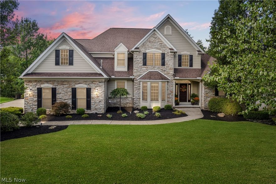 Spectacular custom build stone front colonial. Total remodel! A True pride of ownership! Shows like a new model home! Two-story foyer with newer custom rod iron staircase, runner, & wood floors. Stunning two-story family room w/ custom built-ins, wall of windows, custom fireplace, and stone wall. Beautiful formal dining room w/ newer carpeting. Gorgeous Gourmet Kitchen totally remodeled w/ newer custom cabinets, granite, newer high-end stainless steel appliances including a warmer pantry! First floor laundry room has built-in cabinets & mud room is complete w/ newer built-in lockers. Elegant 1st floor master suite w/ vaulted ceiling, walk-in closet, & glamour bath. Second floor accommodates an additional 3 large bedrooms, one bedroom w/ newer wood floors. You'll love the State of the art finished walkout basement w/ custom wet bar, great room, full bath, exercise room & Storage area. All this and located on a private setting w/ extensive newer professional landscaping, Lux custom patio