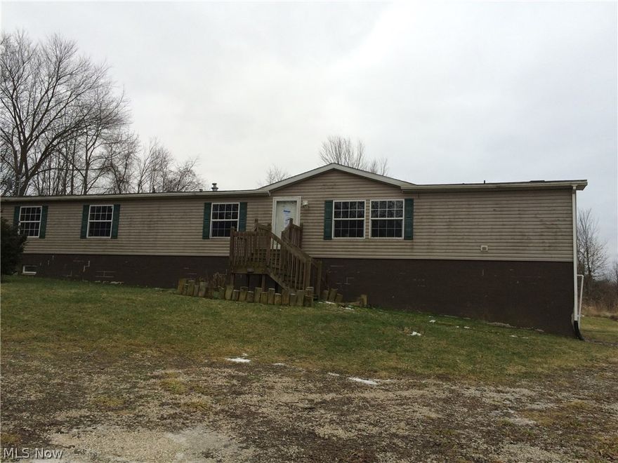 Case #:412-537660. HUD Homes are sold AS-IS. Ask agent for details and instructions to place a bid. This country living ranch offers plenty of space both inside and out. The mobile home has been converted to real estate with a full, walk-out basement. The house offers nearly 2300 square feet of finished living space on the main floor and is located on over 5 1/2 acres. Enter the house through the living room. Off to one side is the master suite that includes duel closets, master bath and an extra tandem bedroom (not counted in bedroom count) that could be used as a nursery or office or whatever you desire. The spacious kitchen and dining room lead to the family room with a fireplace for those chilly nights. Down another hall is the laundry room, 3 more bedrooms and 2 more full bathrooms, one of which is a Jack & Jill bath between 2 of the bedrooms. A back deck overlooks the open, country yard, perfect for watching sunsets or hosting BBQs. The walk out basement offers plenty of storage