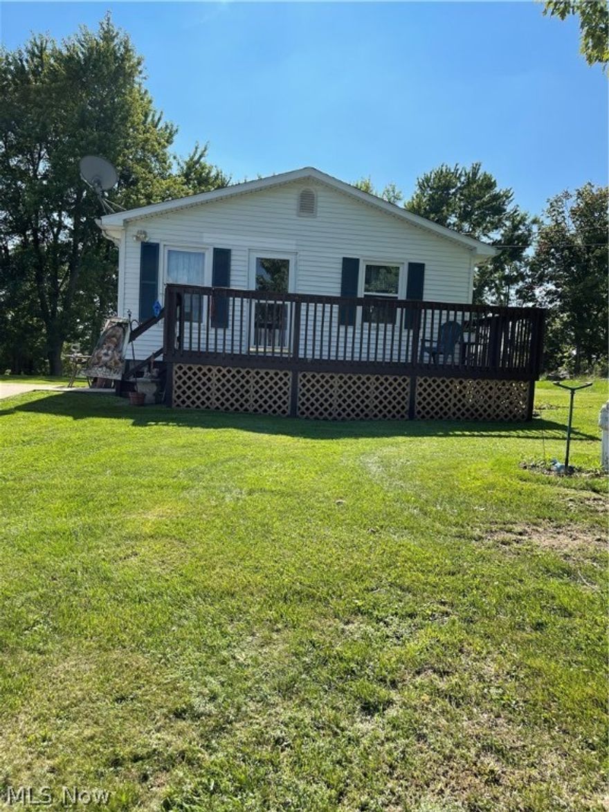 Great one level ranch home with front porch and back deck. A very nice yard in a lovely area. You are out of town but close enough to be in town very quickly to the mall or store, Drs or Parmacy. This makes this home very appealing.  You are steps from the front porch a very nice size for your porch furniture.  Stepping into the living room it is actually well lighted and very cozy. The kitchen is a very nice size with an abundance of cabinets and it is very open to the dining area.  There is an exit door to outside from the dining room. Three very nice size bedrooms and the main bedroom has an on suite. A family bath is also on this main level.  Steps go down to the basement area into a very nice sized rec room and that room leads you into the laundry area. There is another exit door to the outside from the laundry room.  There is also a room that this owne uses as an office it could be for various uses. This is a great home for many uses.